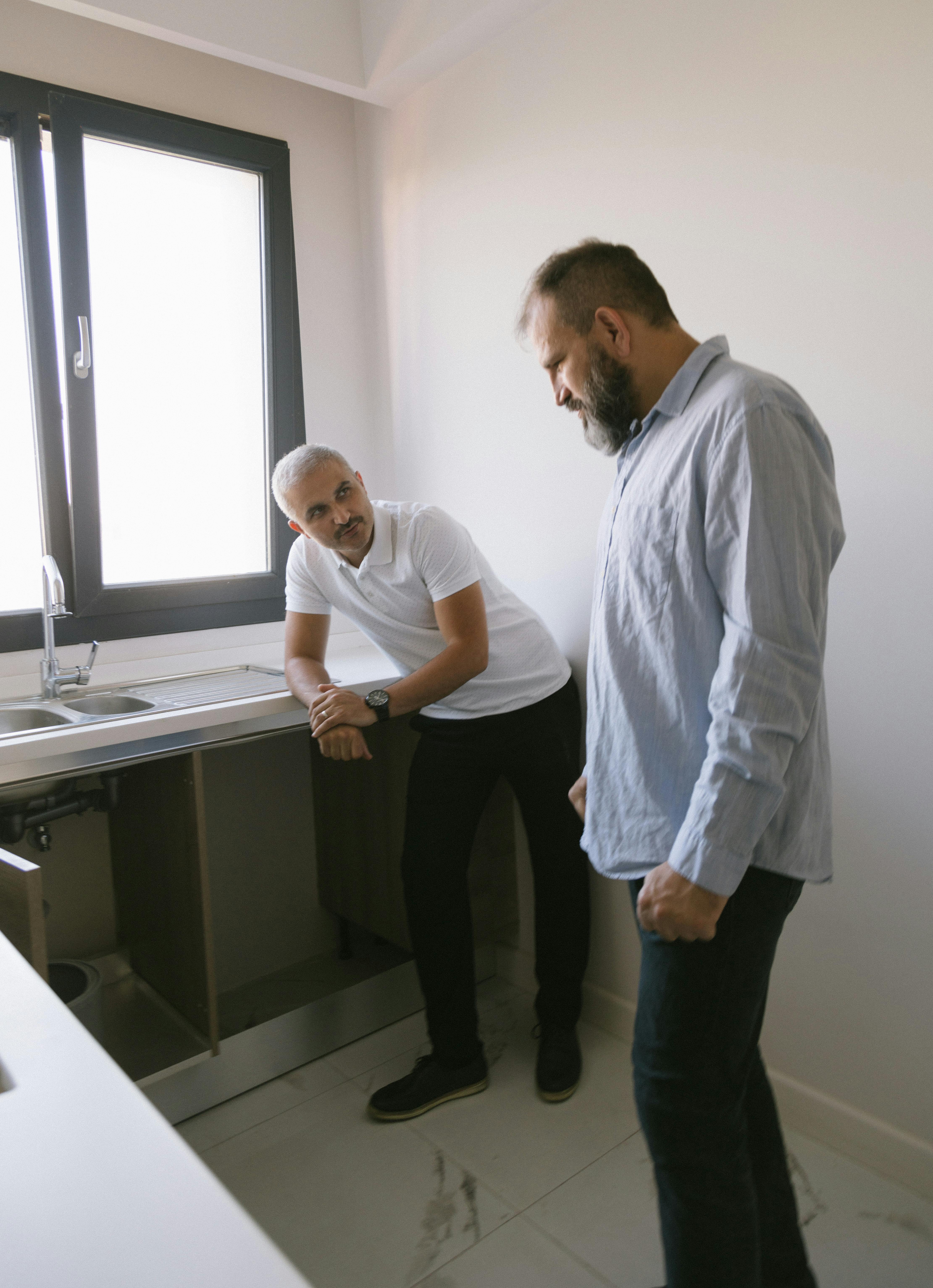 Sparkes Plumbing team consulting with a customer